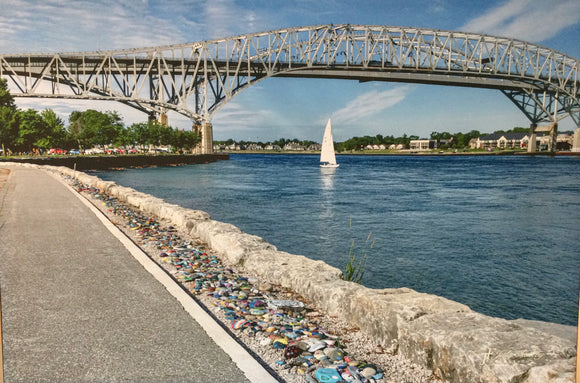 White Sailboat under the Bluewater Bridges