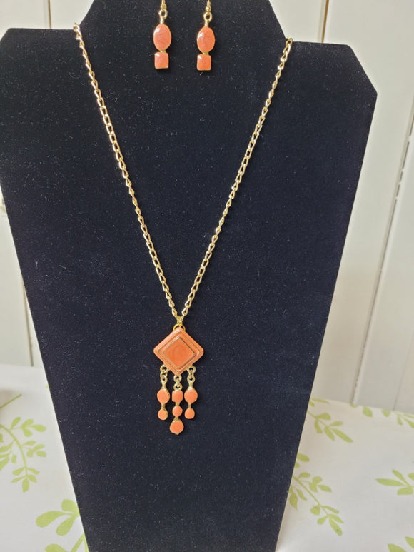Coral tone necklace and earrings set