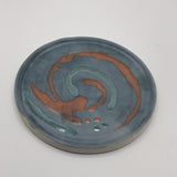Blue plate with orange marks